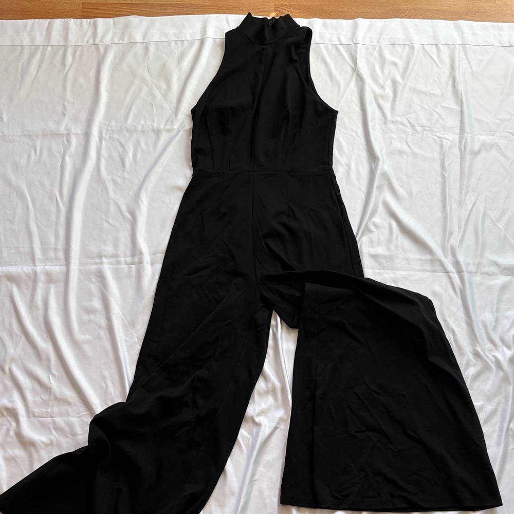 Elegant Black Sleeveless Jumpsuit with Keyhole detail and turtleneck, Wide Leg
